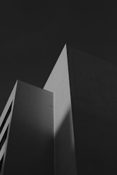 A black and white photo of a tall building