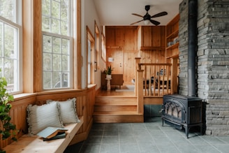 A living room filled with furniture and a fire place