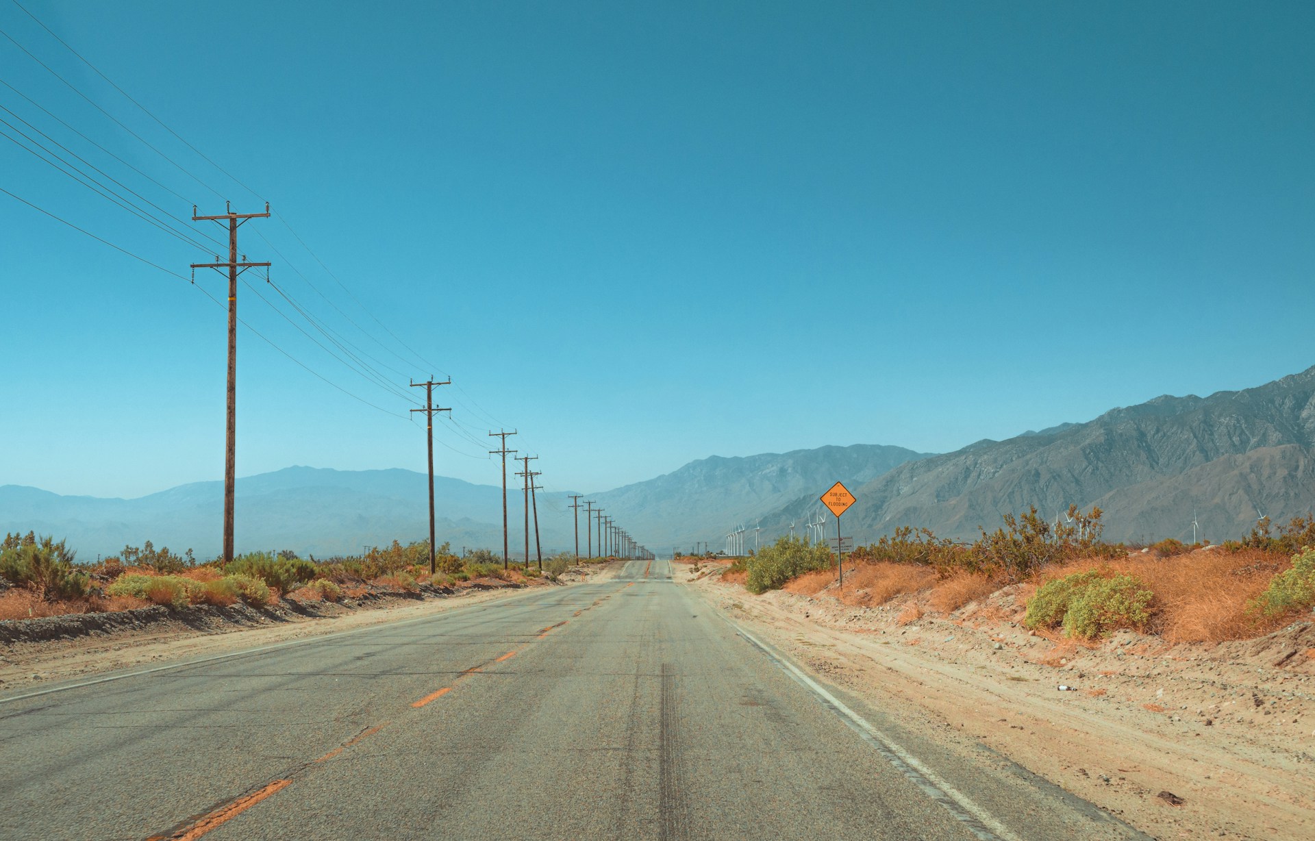 An empty road in the middle of the desert