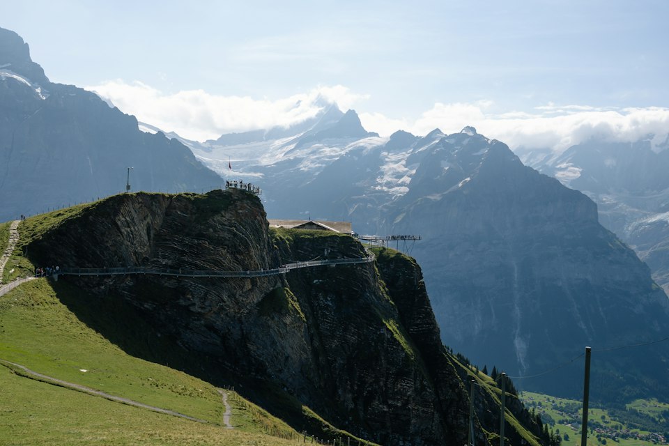 The First Cliff Walk suspended platform jutting out over the mountainside above Grindelwald, with the Bernese Alps behind