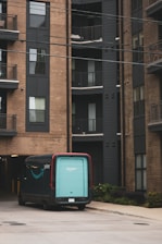 A couple of suitcases that are in front of a building