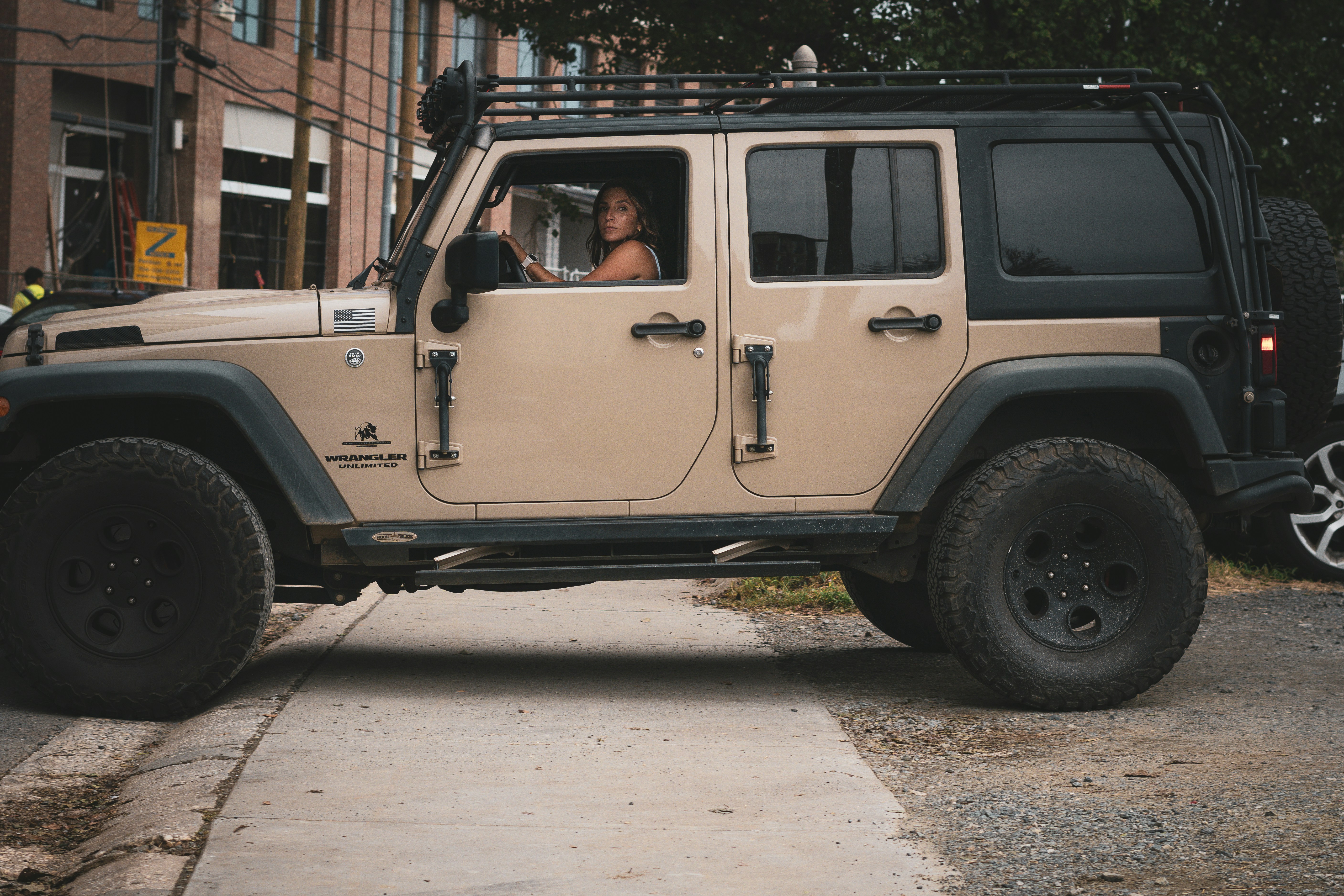 A jeep is parked on the side of the road