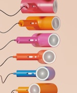 A set of four different colored electric toothbrushes