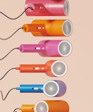 A set of four different colored electric toothbrushes