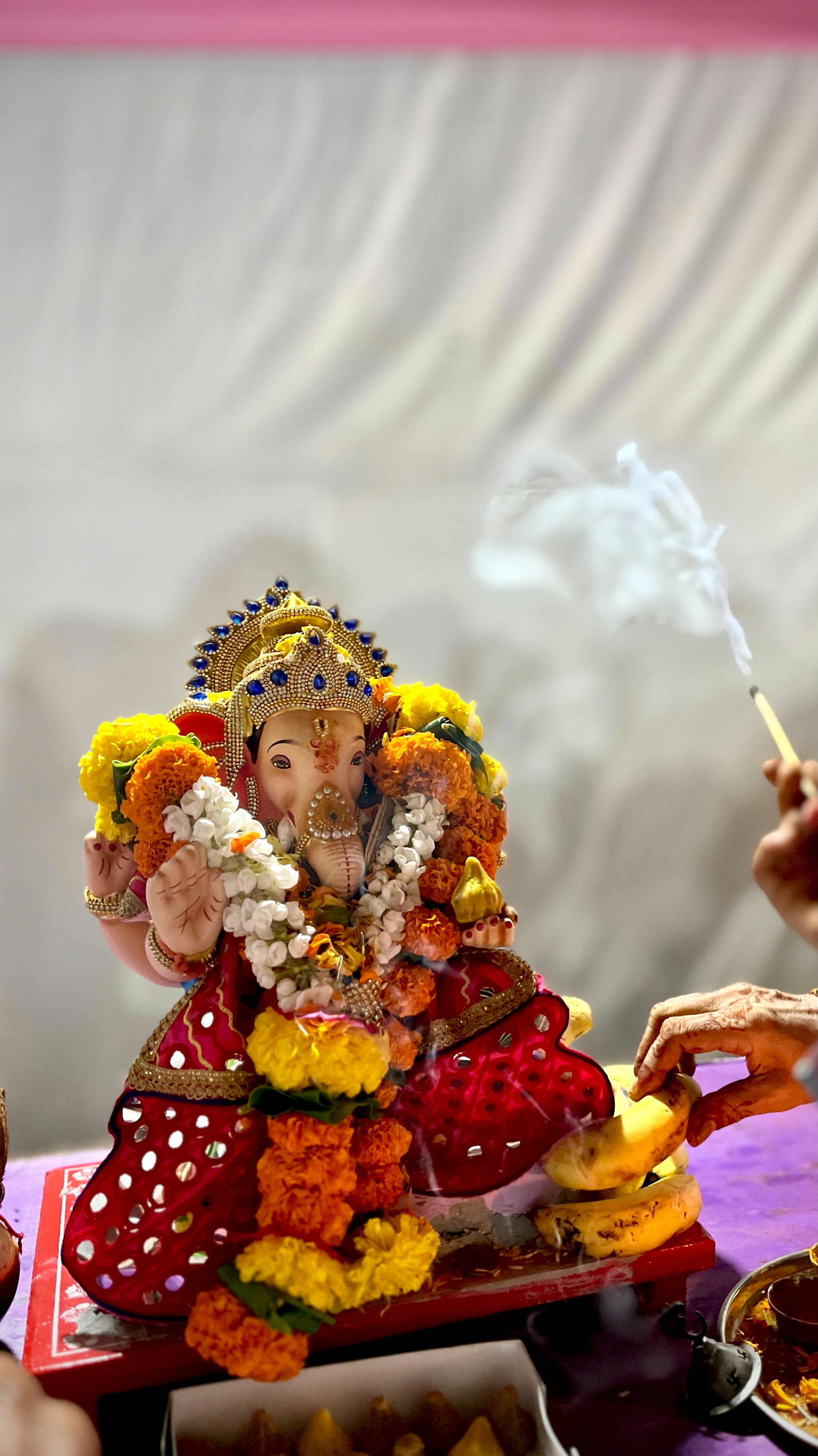 A statue of an elephant with a man smoking a cigarette