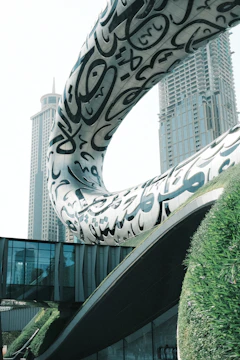 A woman standing in front of a building
