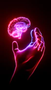 A person's hand holding a glowing brain model