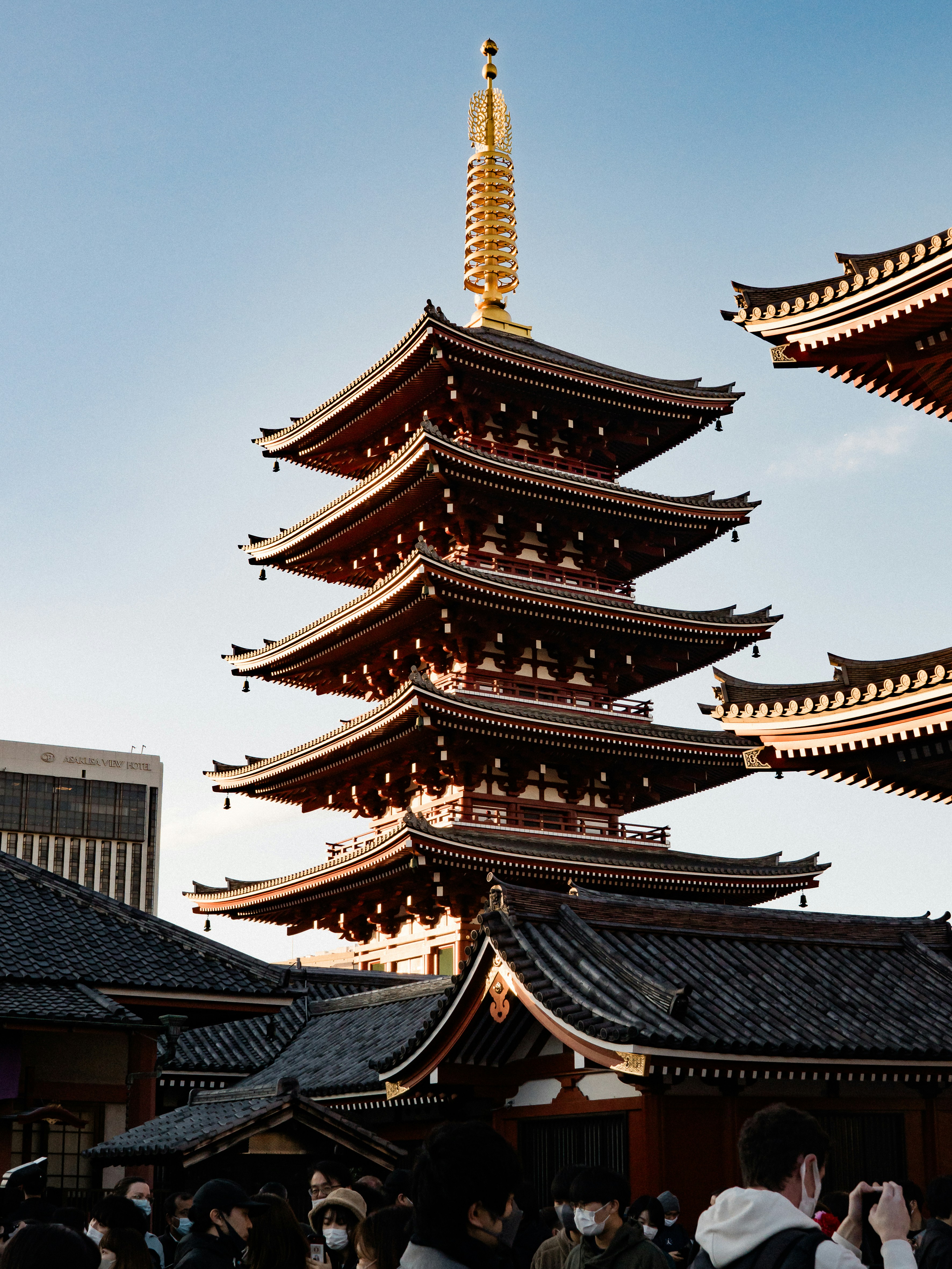 A group of people standing in front of a tall building