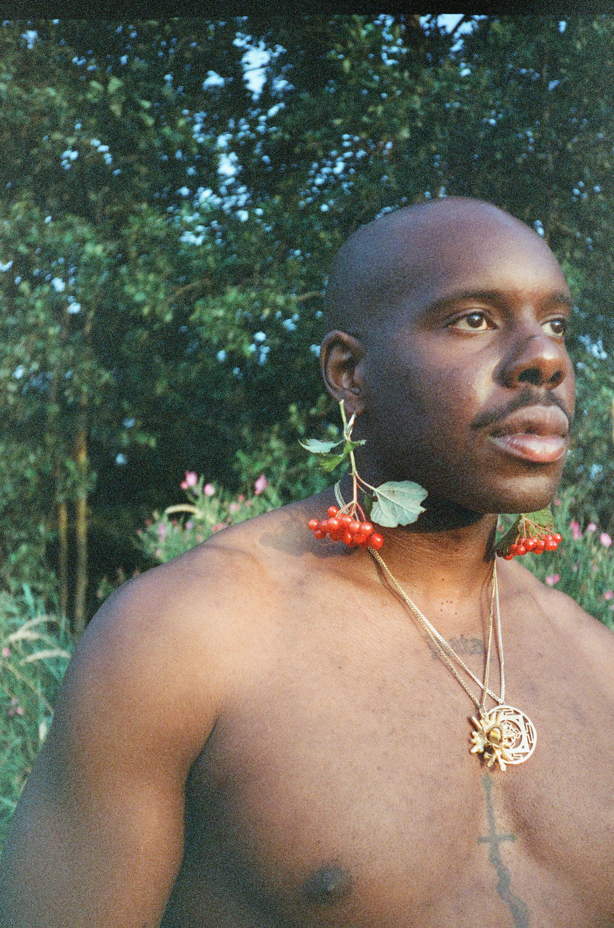 A man with a flower in his hair