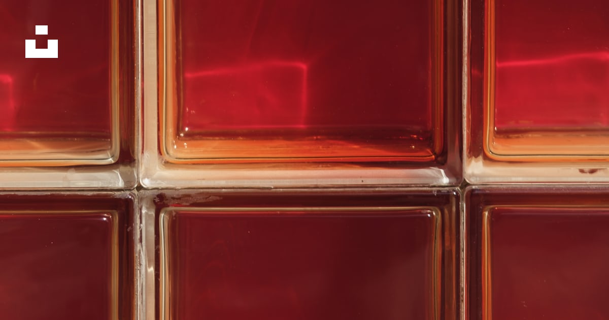 A close up of a red glass block wall photo – Free Red Image on Unsplash