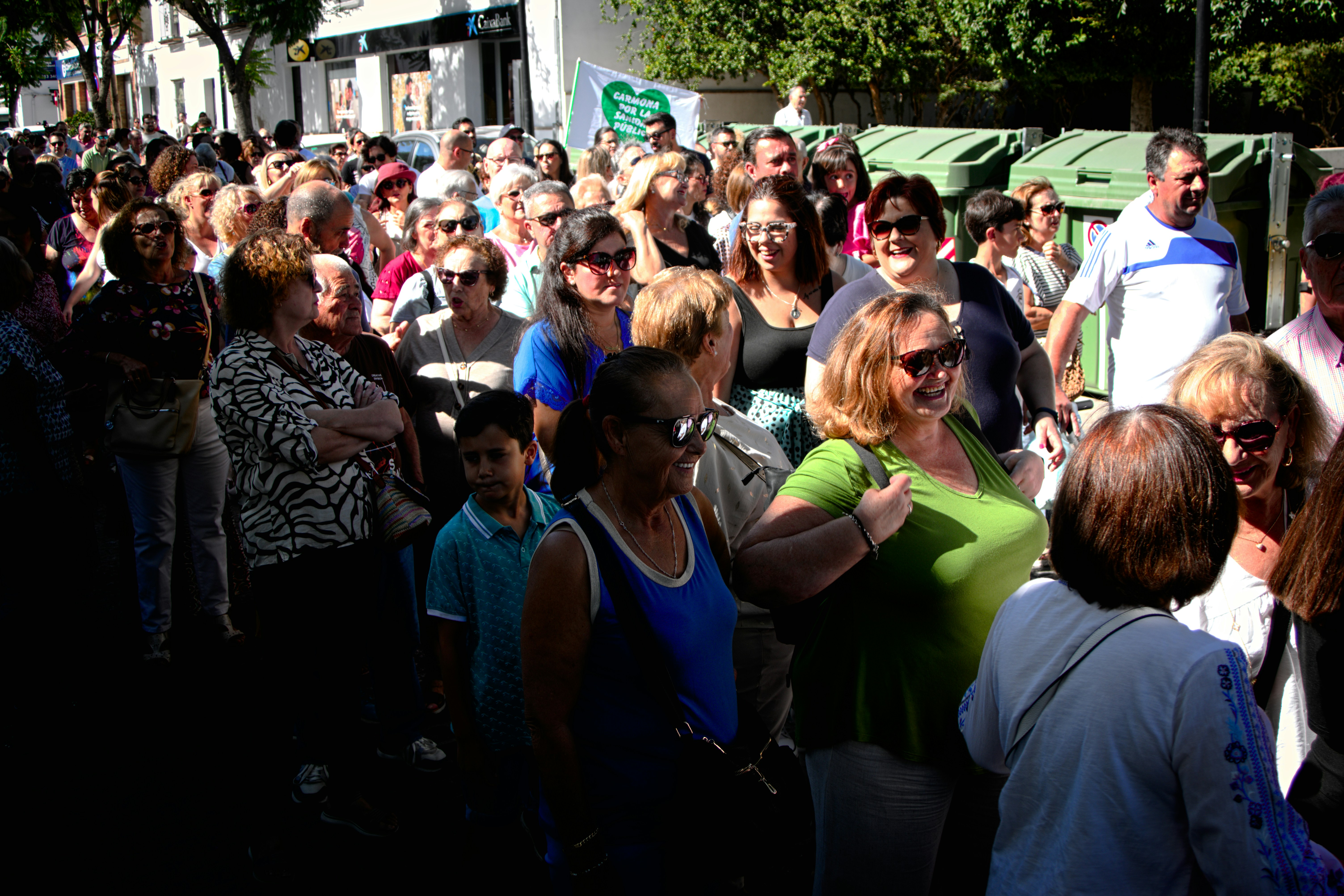 A large group of people standing around each other