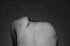 A black and white photo of a woman's back