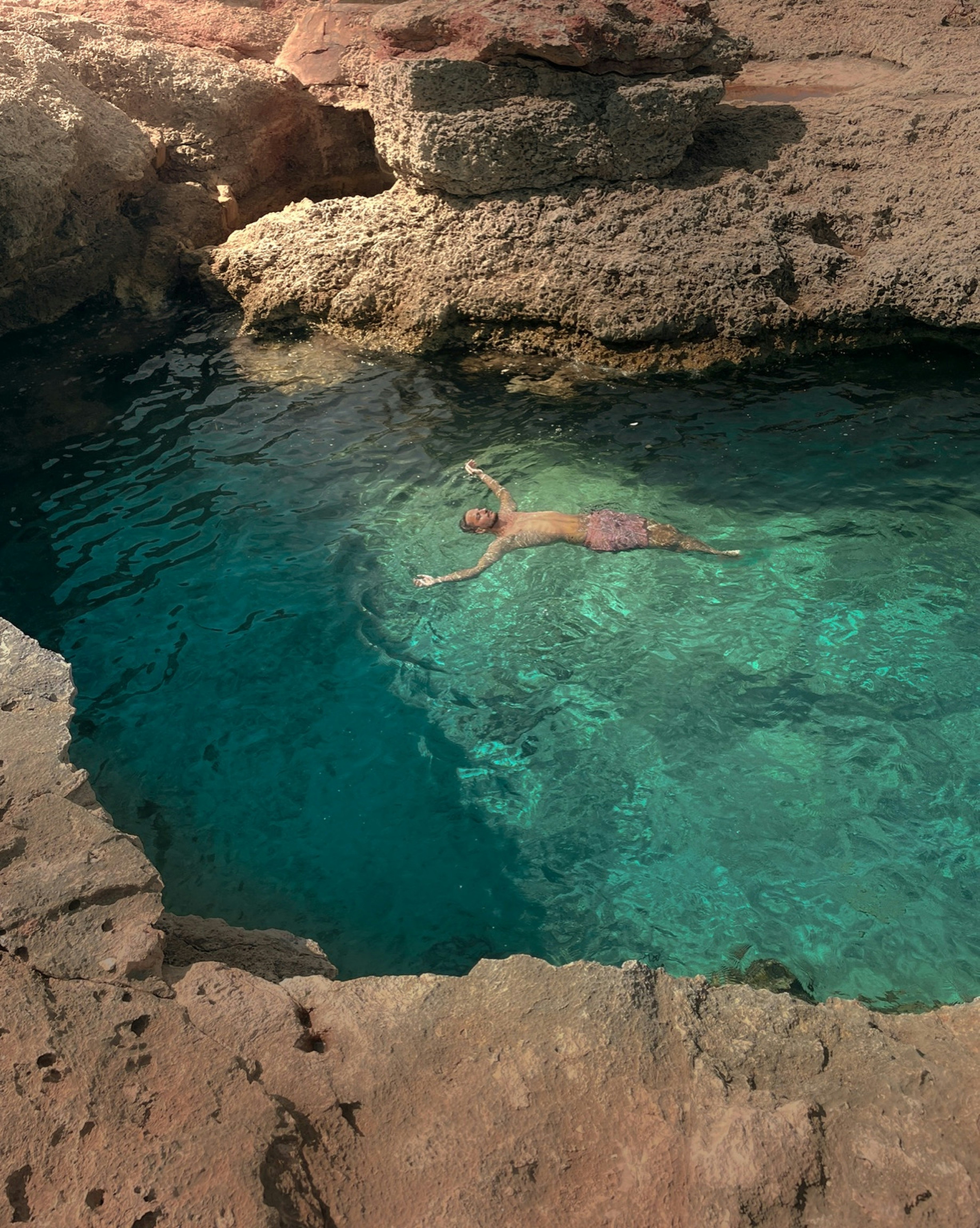 A person swimming in a pool of water