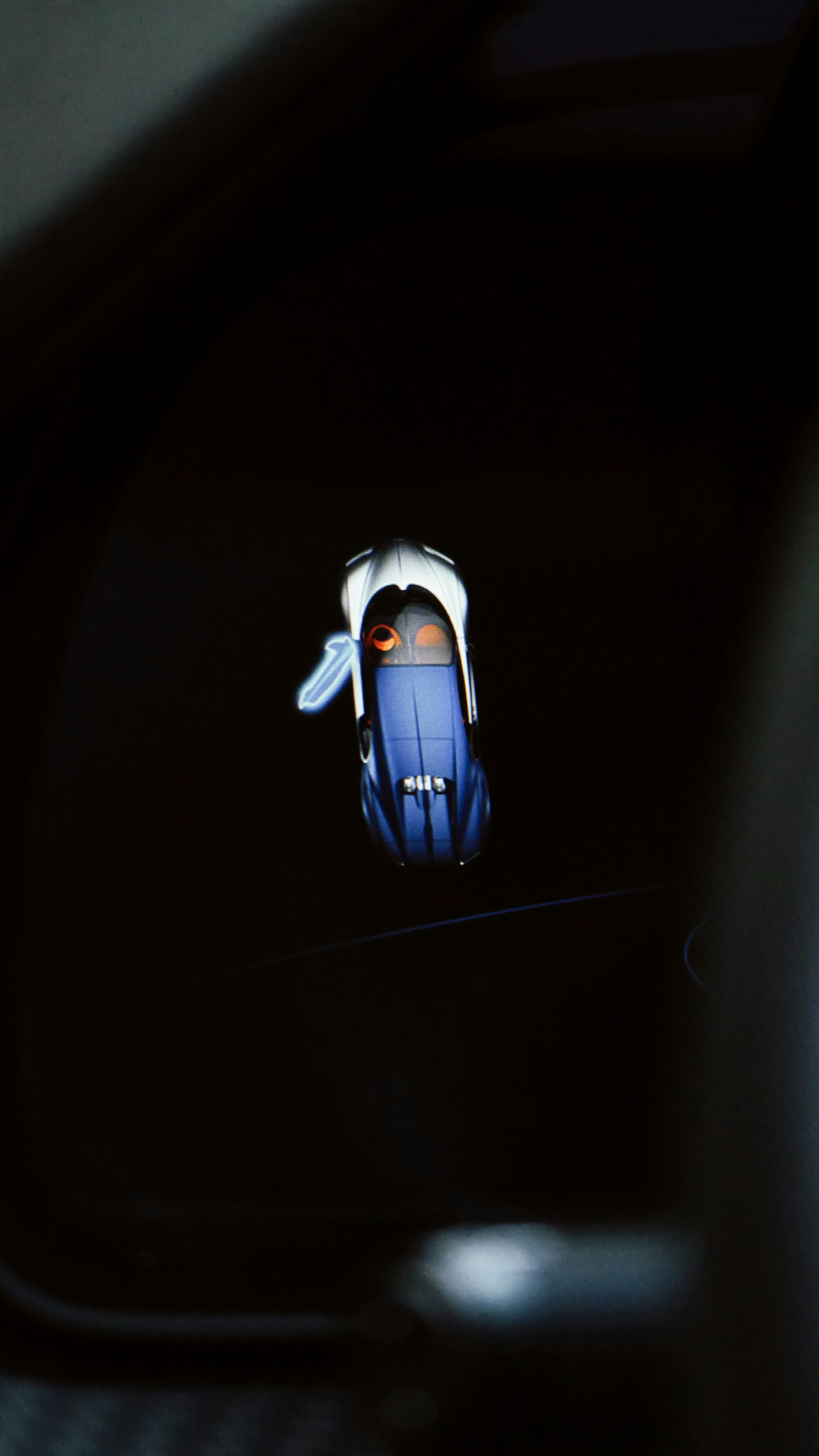 A close up of a cell phone in a car