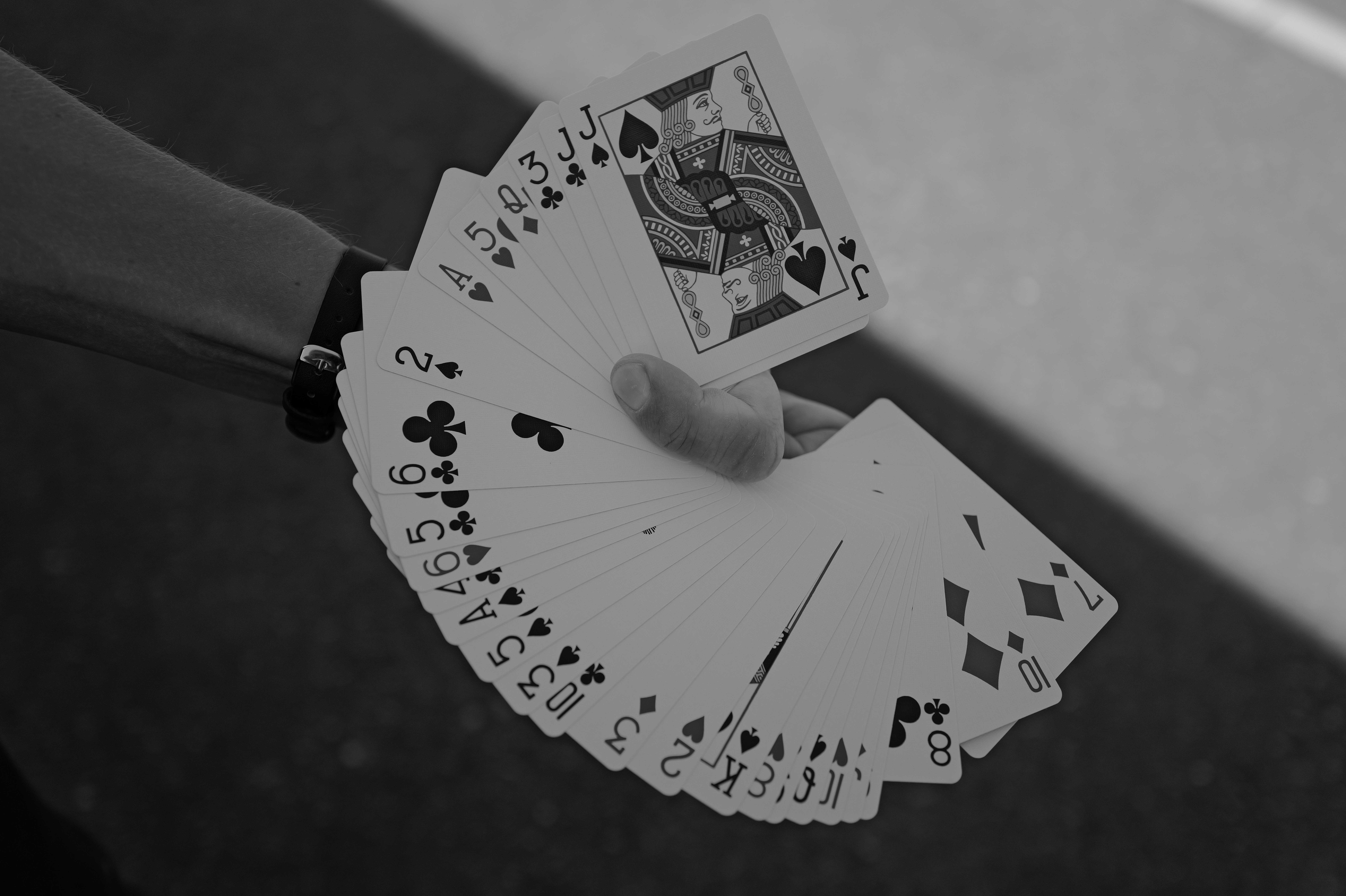 A person holding a deck of playing cards