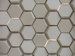 A close up of a wall made of hexagonal tiles