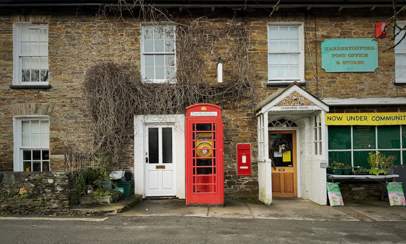 UK village post office with a red telephone box