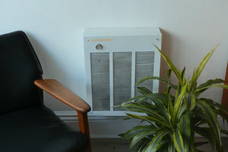 A room with a chair and a heater