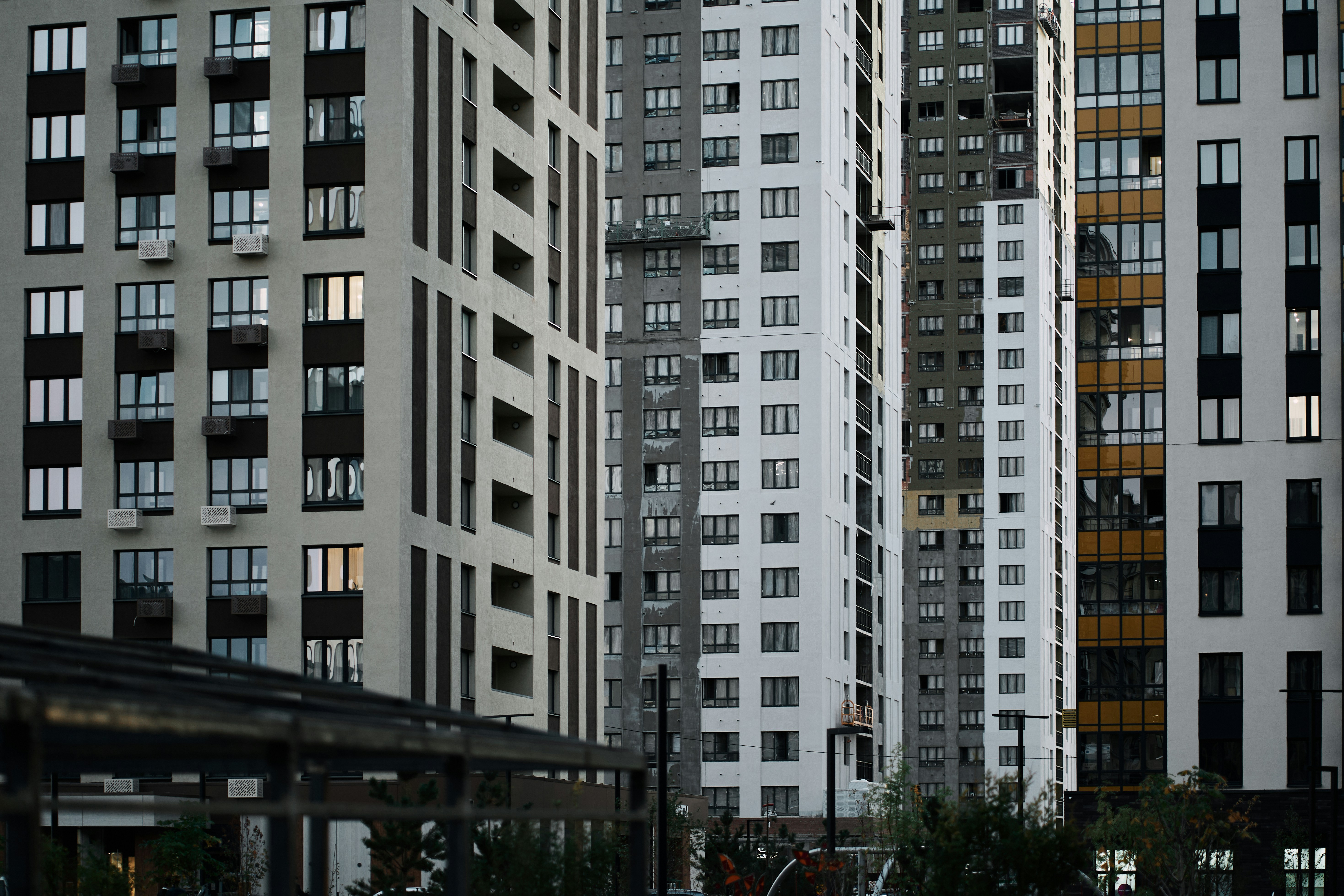 A couple of tall buildings sitting next to each other