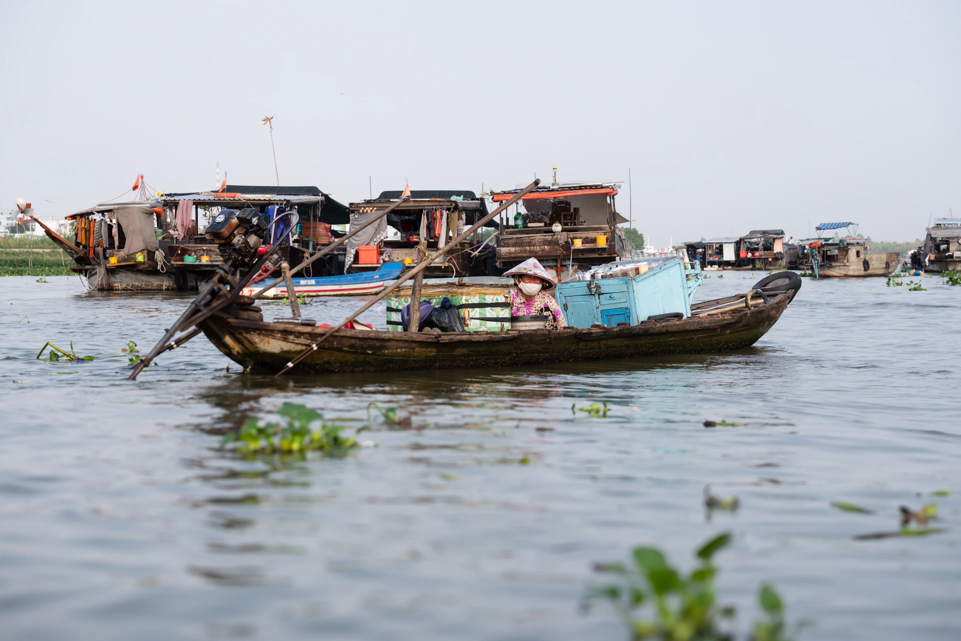 A group of boats floating on top of a body of water
