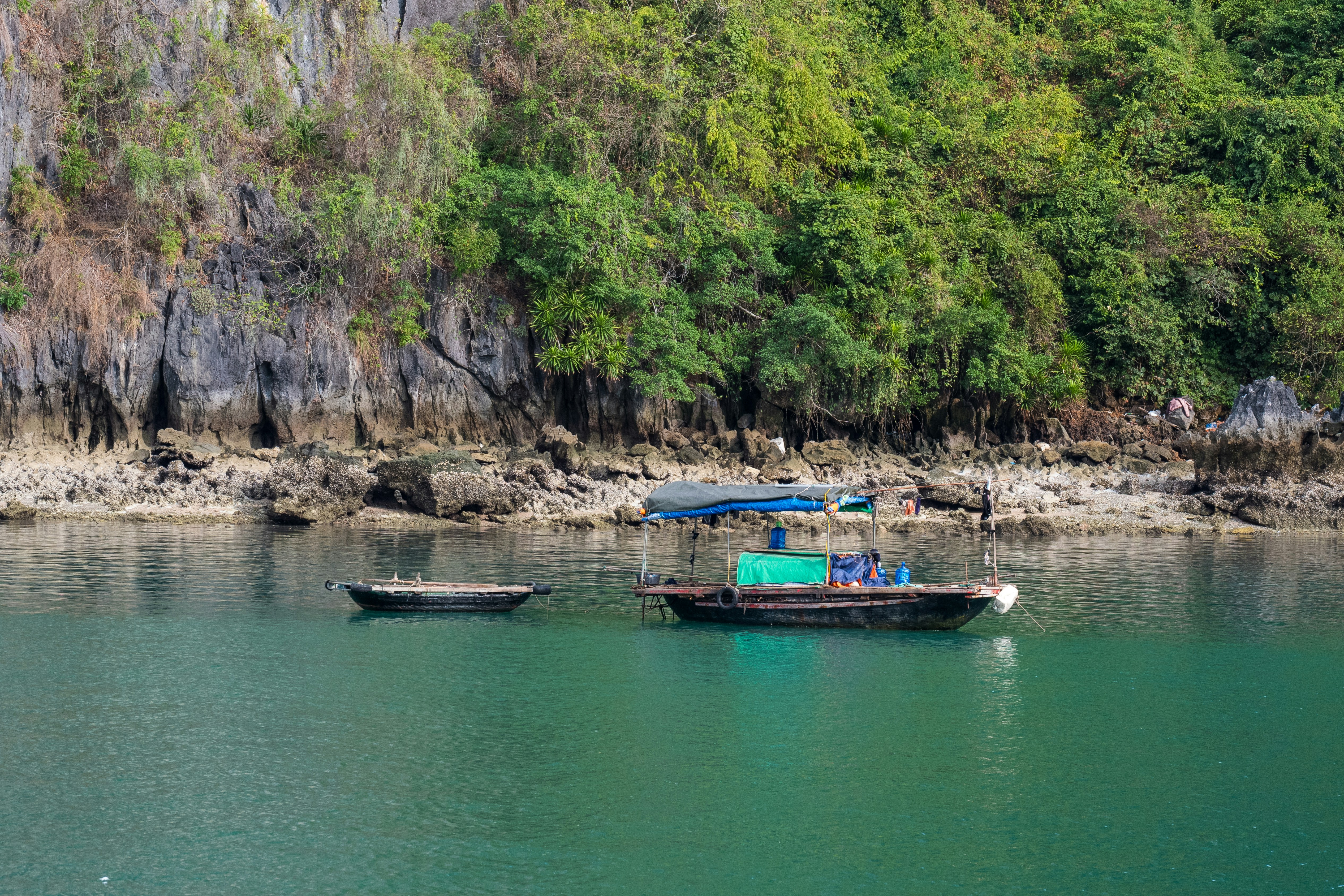A group of boats floating on top of a lake