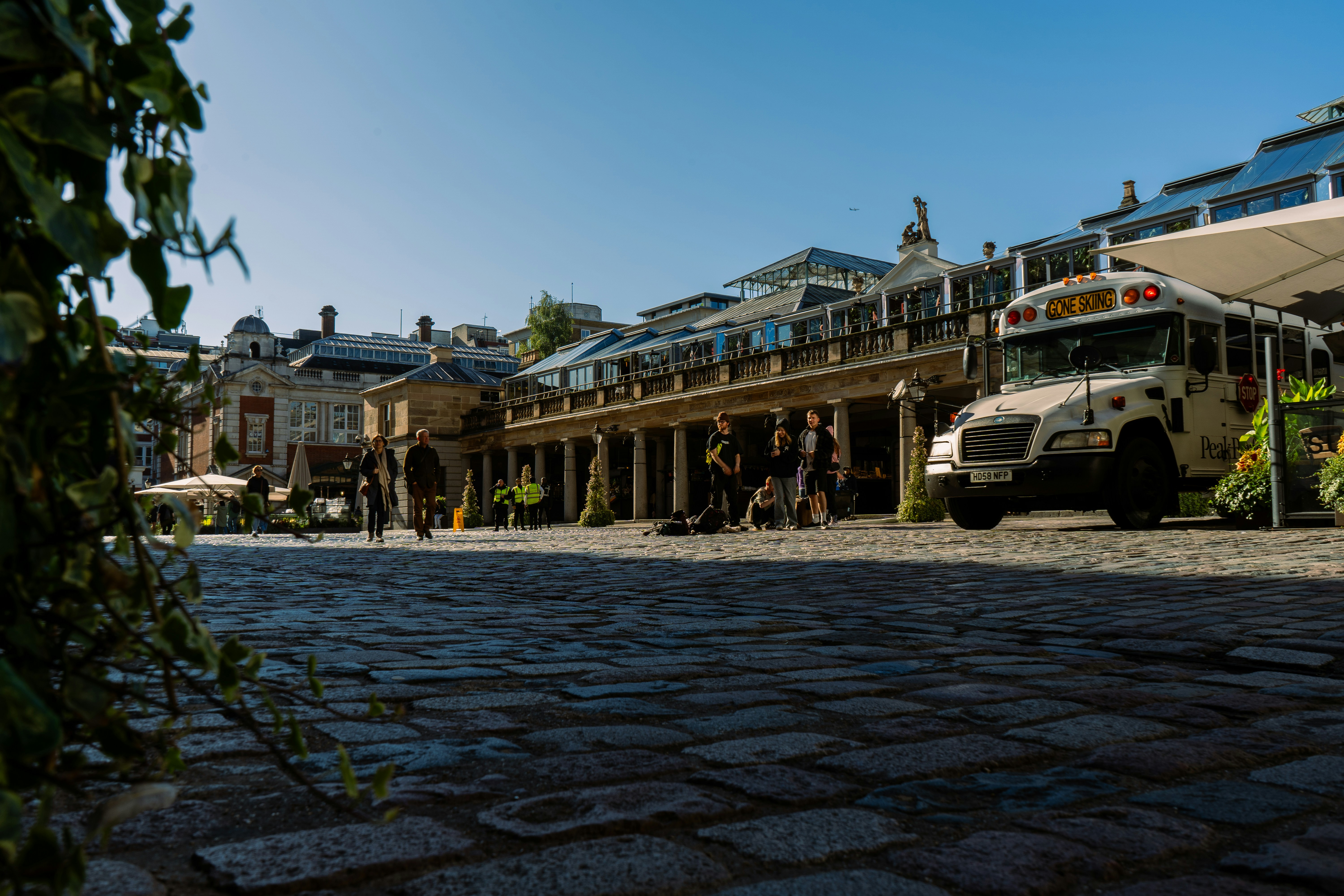 A bus is parked in front of a building