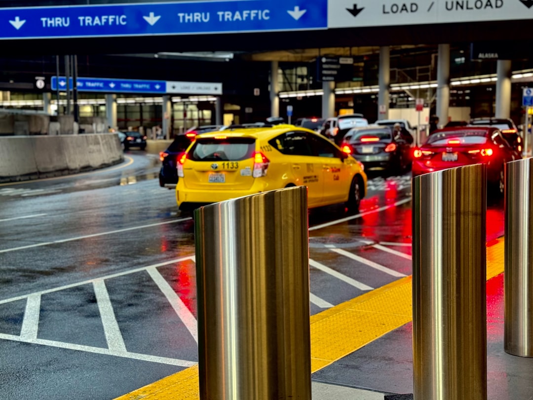 A city street filled with lots of traffic, Traffic at an airport.