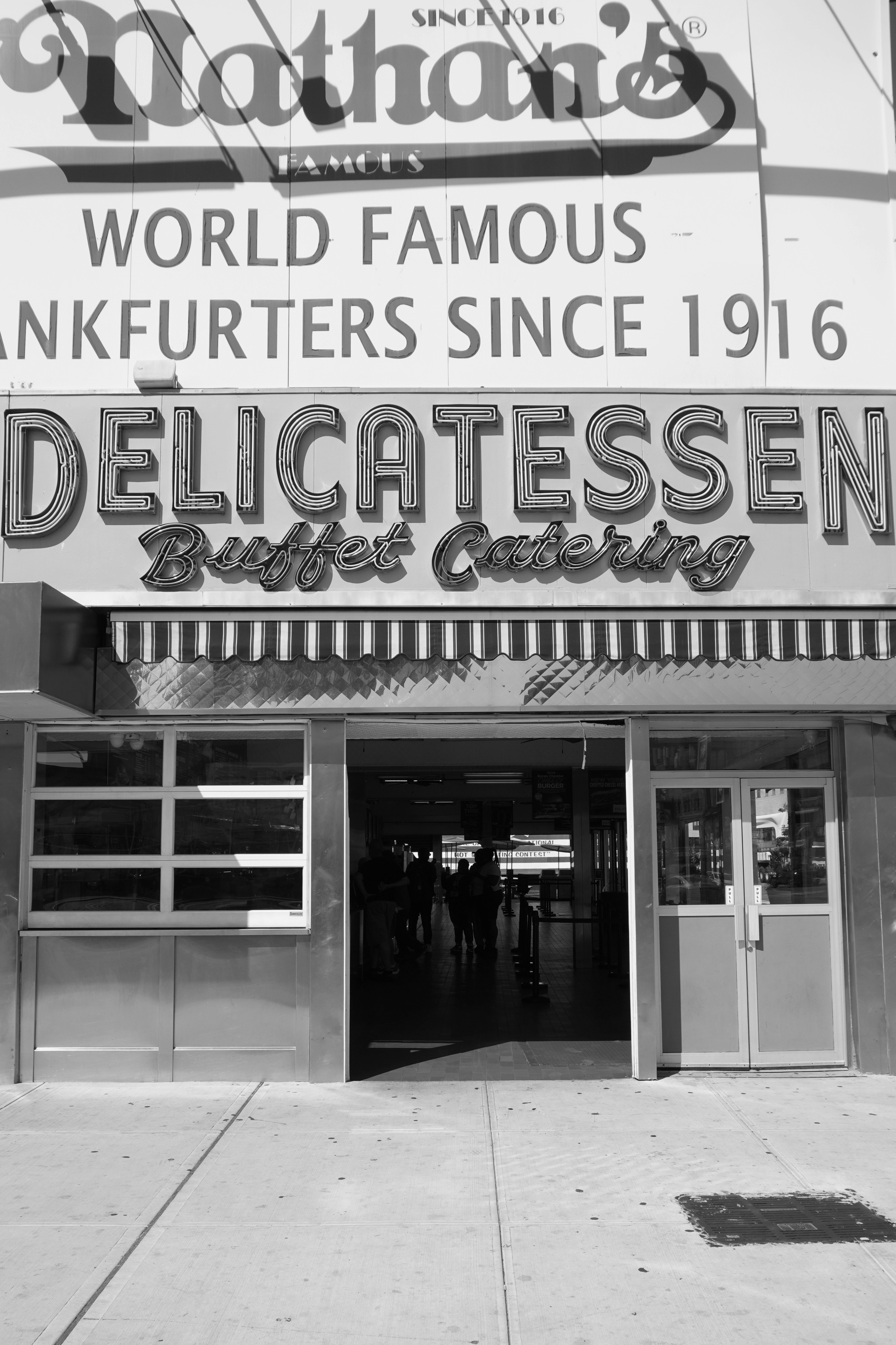 A black and white photo of an old movie theater
