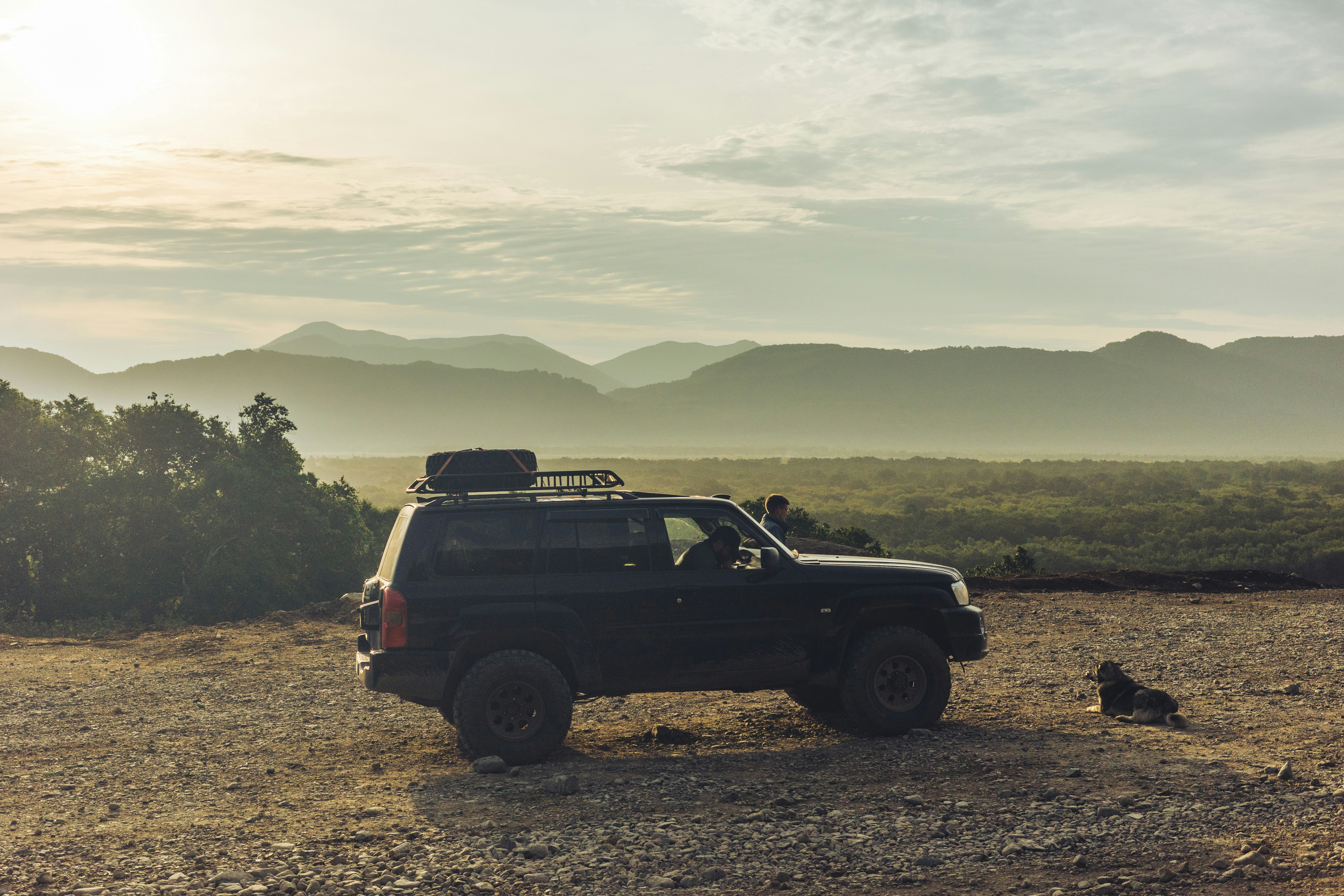 A truck parked in the middle of a field