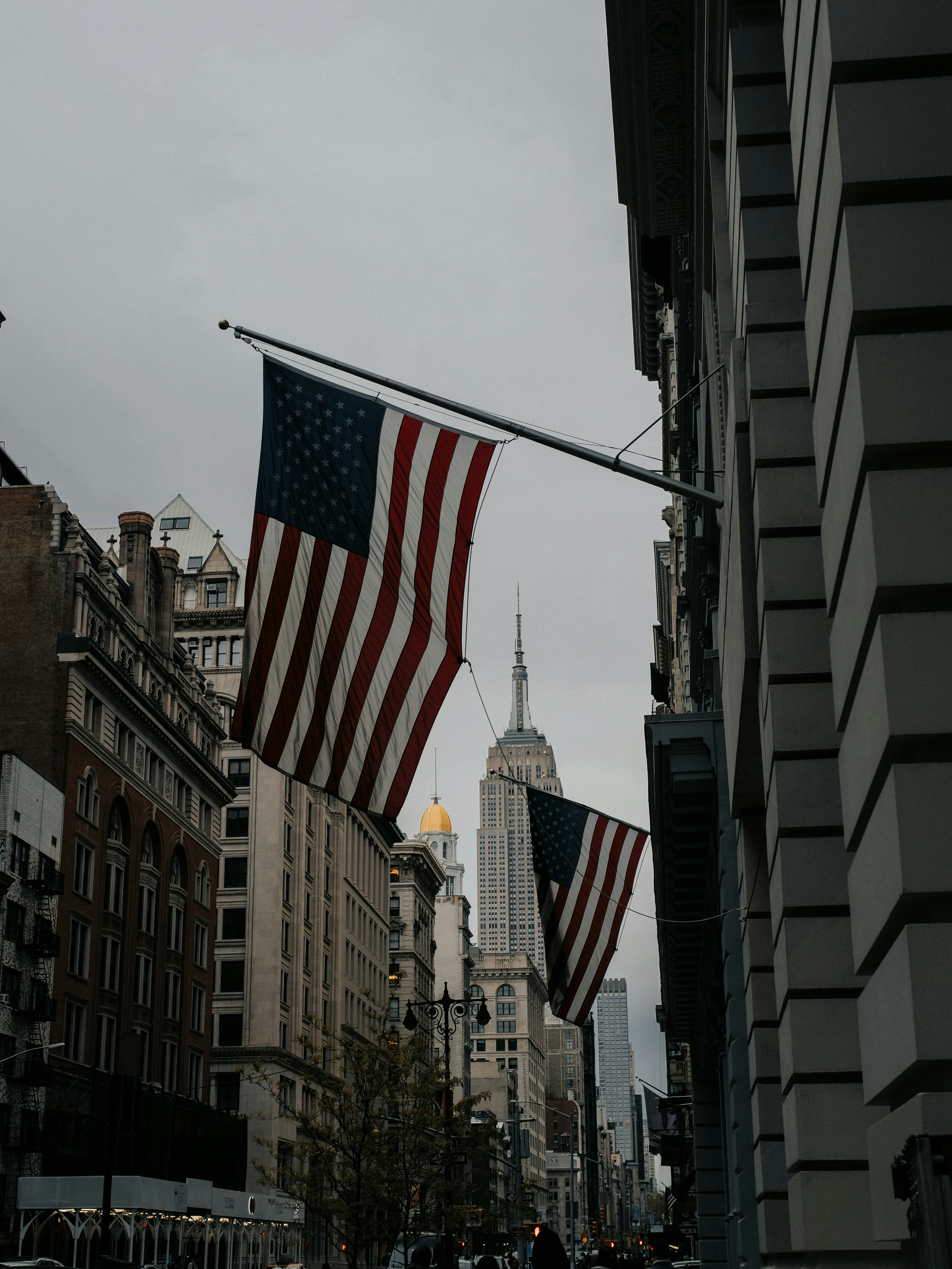 A city street filled with lots of tall buildings