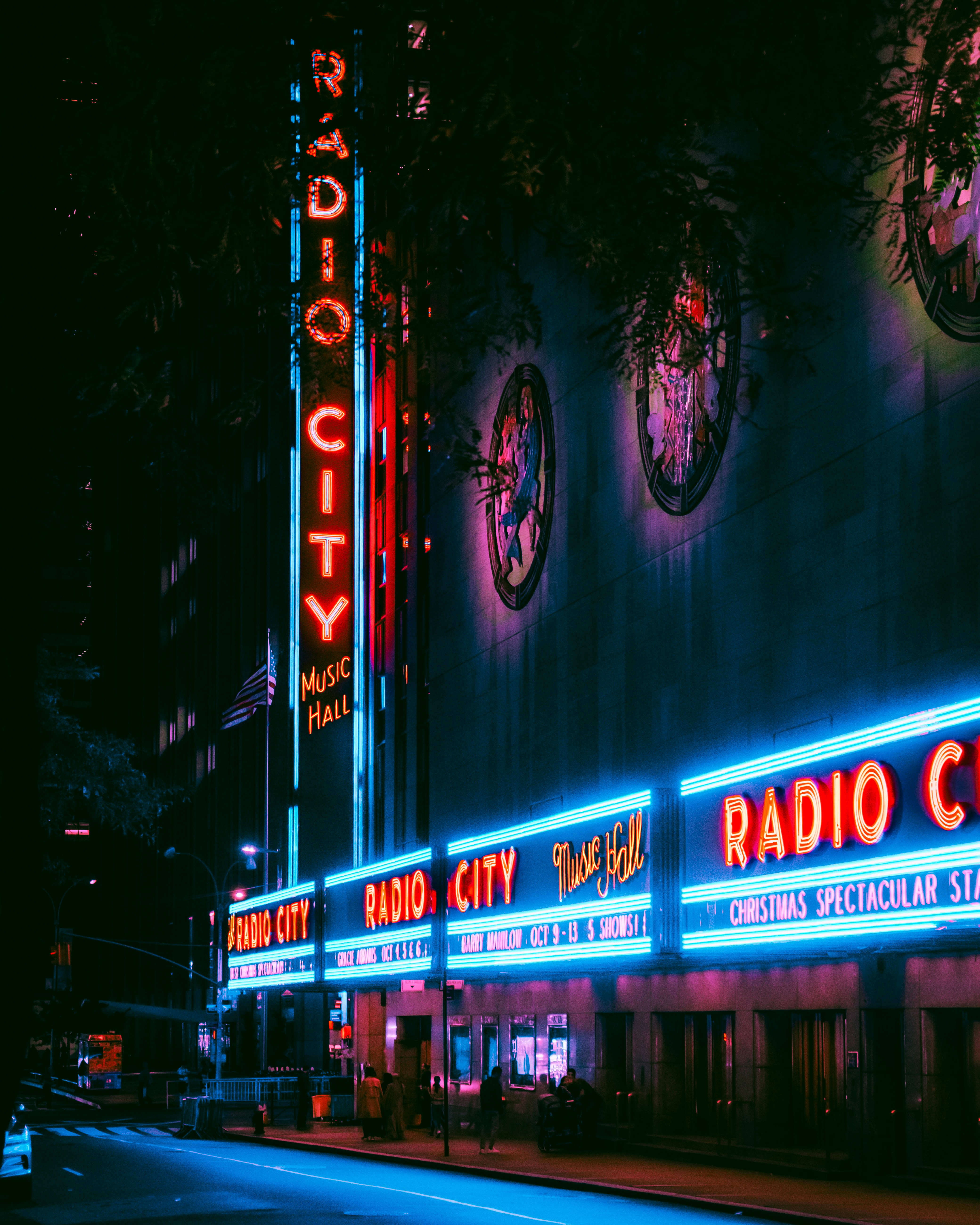 The radio city radio city building lit up at night