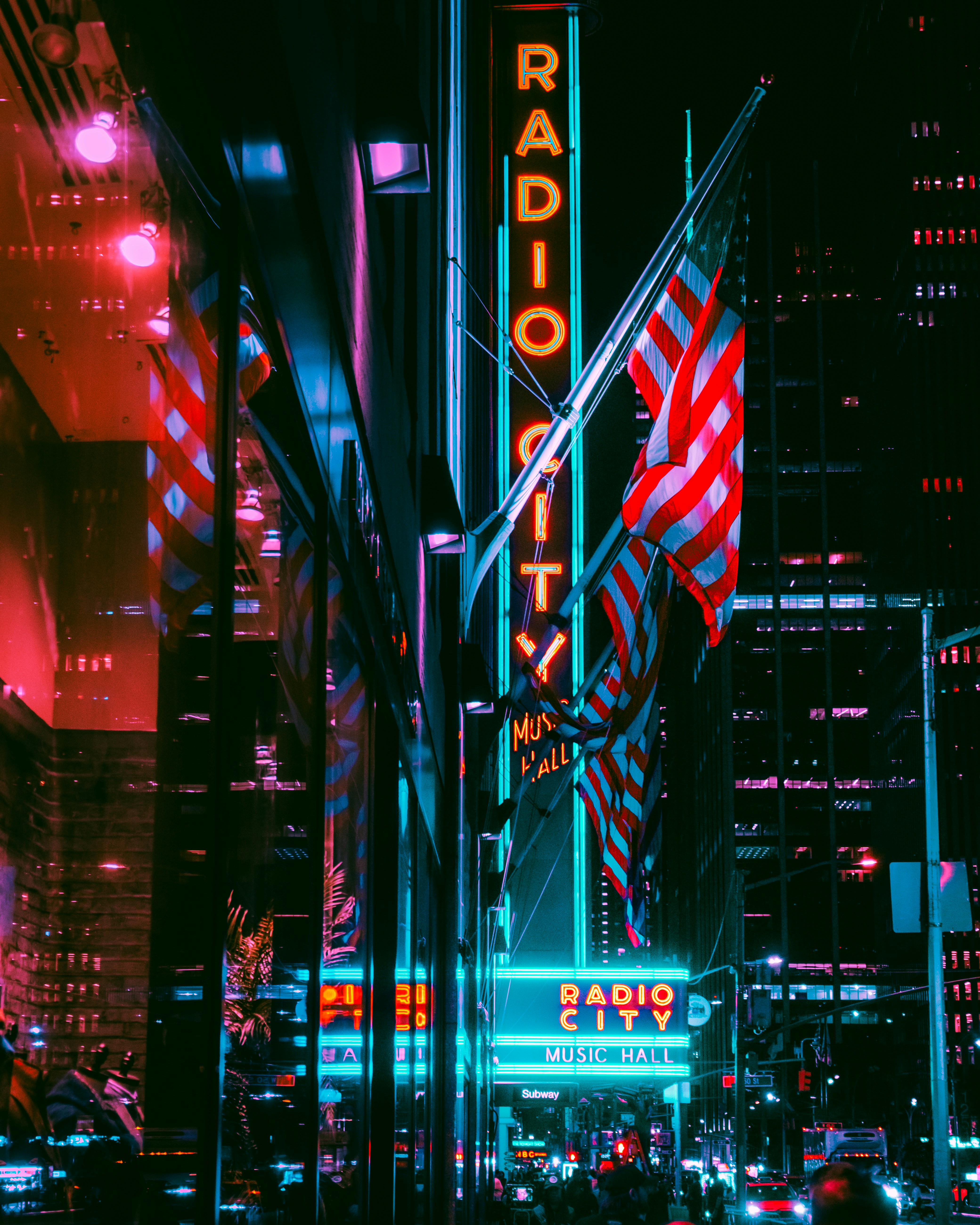 A city street filled with lots of tall buildings