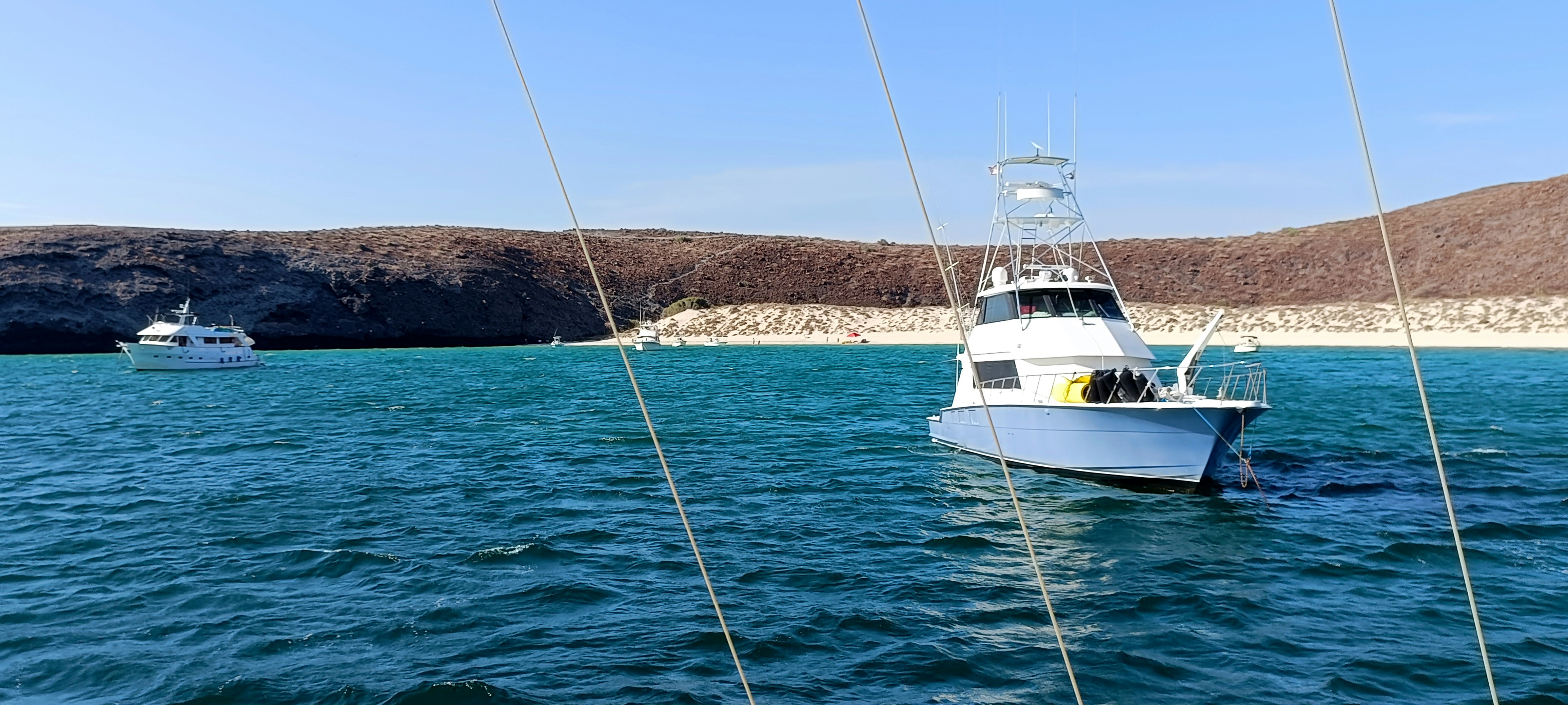 A white boat floating on top of a large body of water