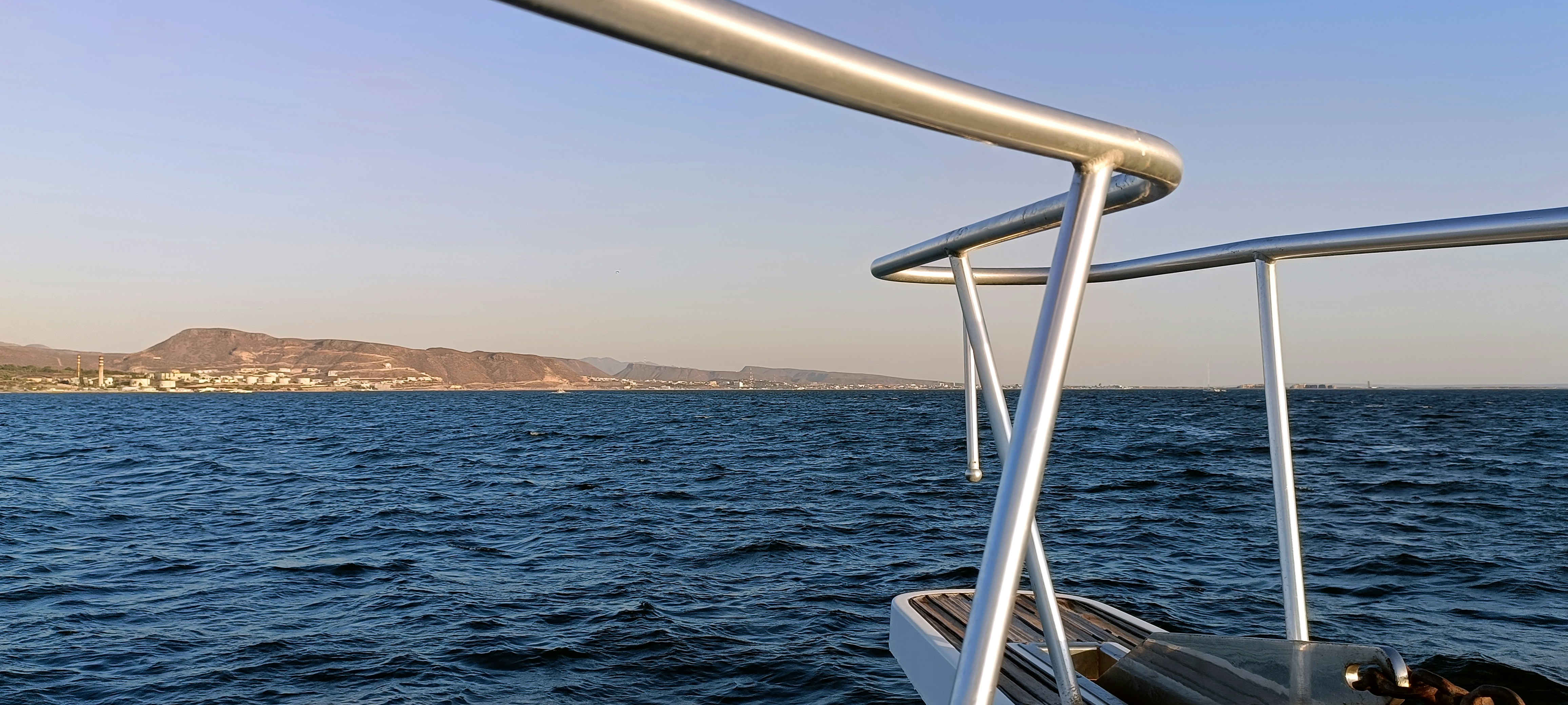 A boat traveling across a large body of water