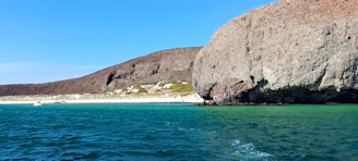 A large rock in the middle of the ocean