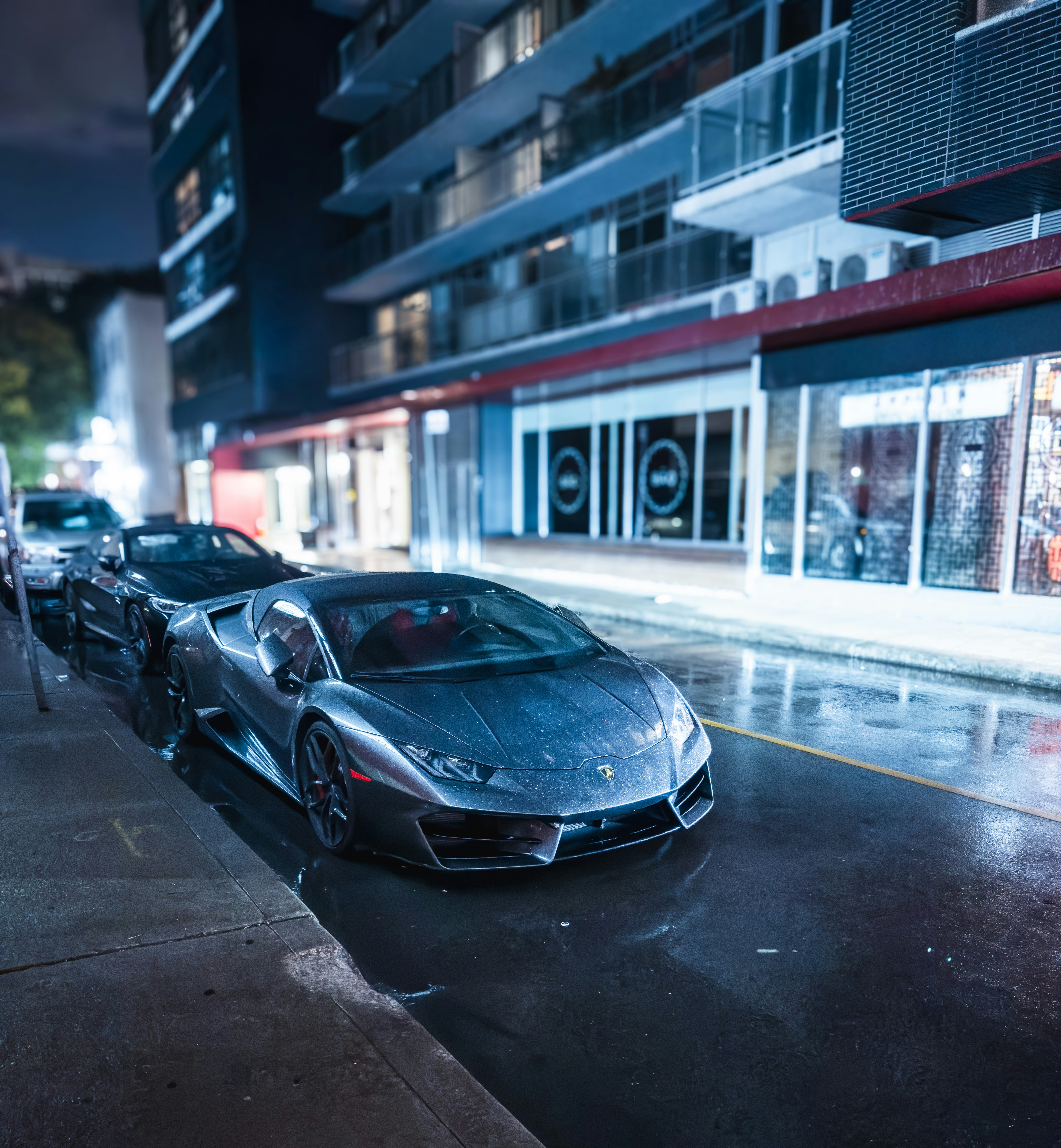 A row of parked cars sitting on the side of a road photo – Free On m5t ...