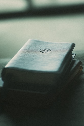 A book sitting on top of a table next to a window
