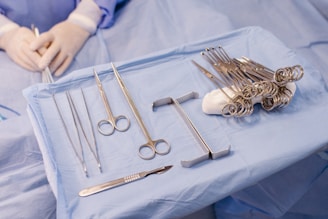 A hospital bed with surgical equipment on top of it