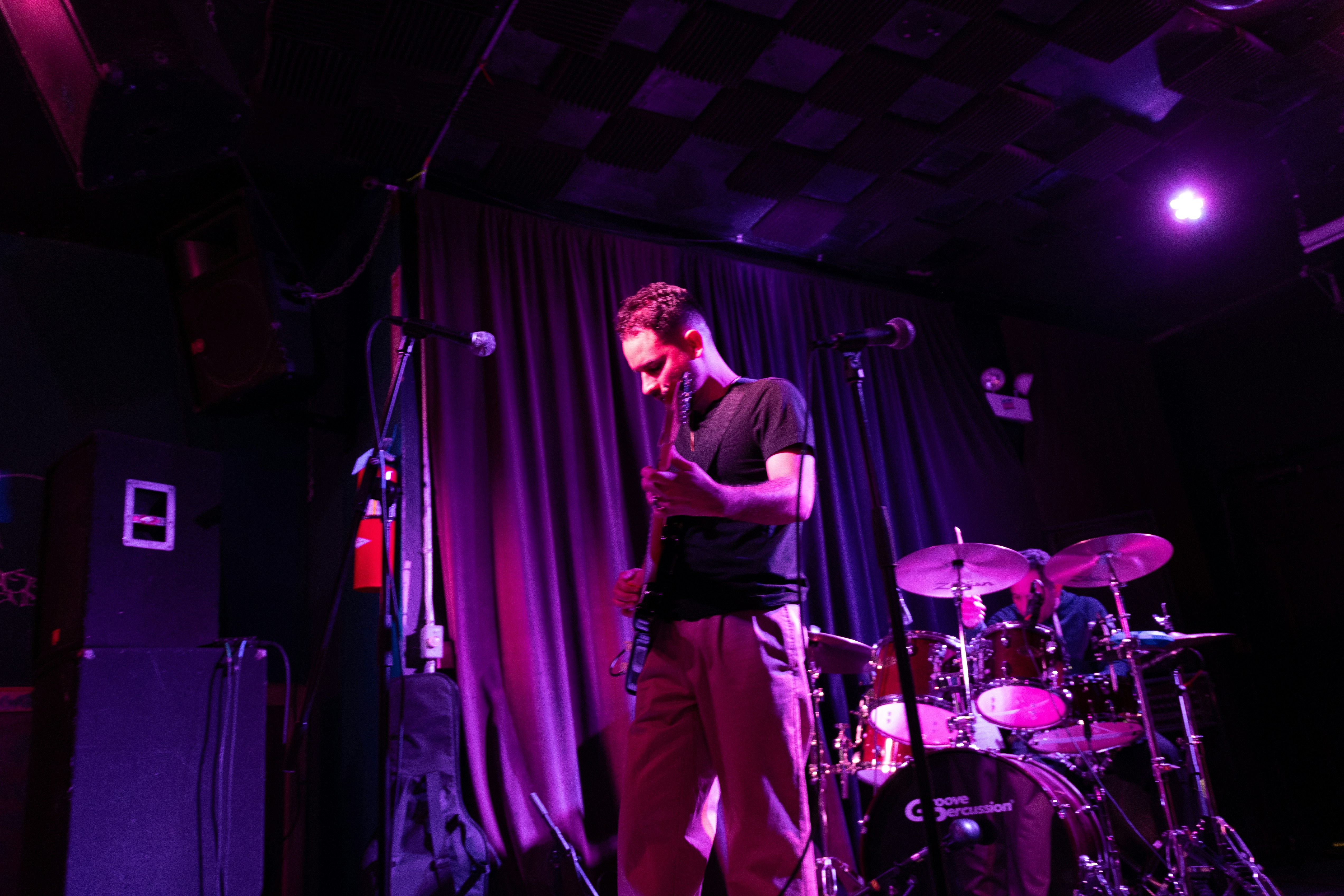 Musician on stage with drum set