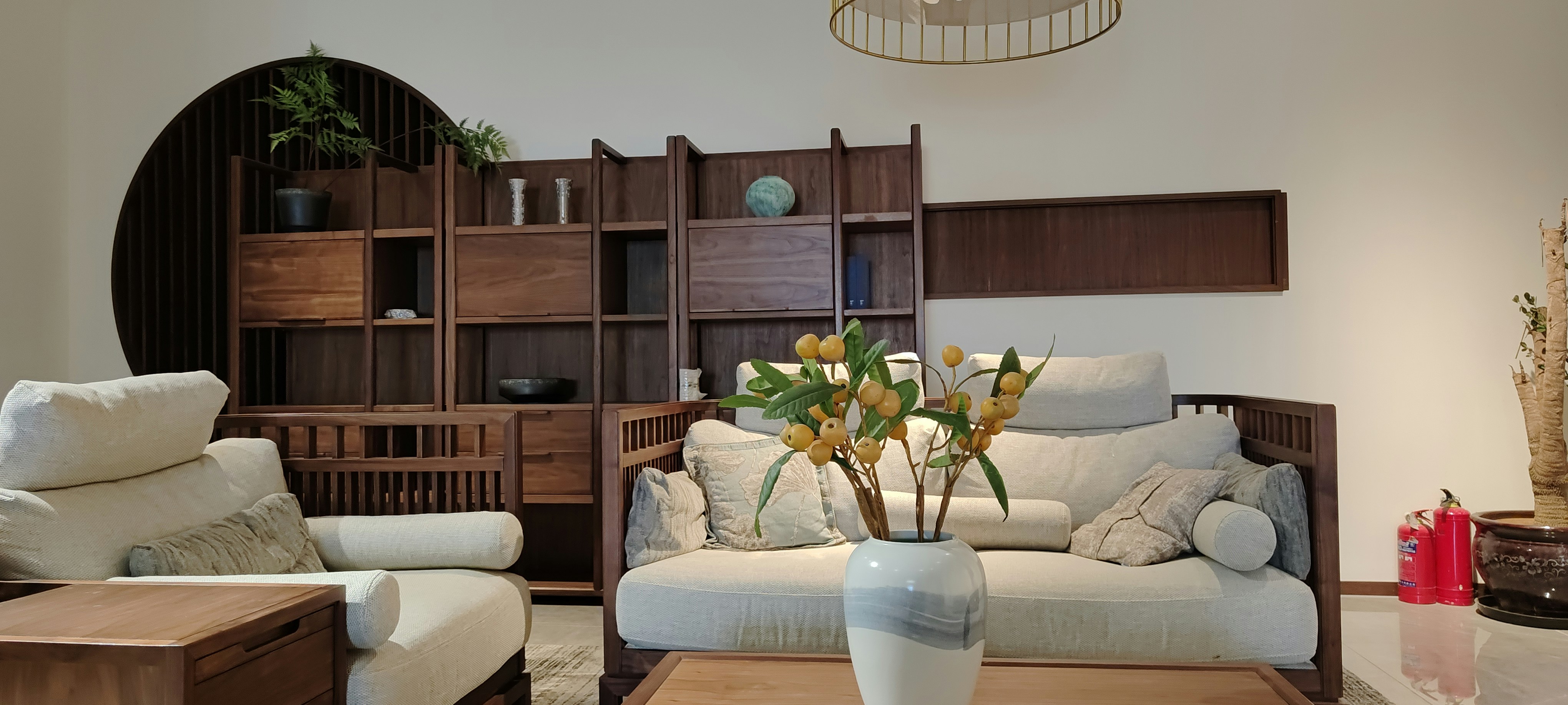 Modern wood wall shelving system in a bright living room with minimal decor and natural light
