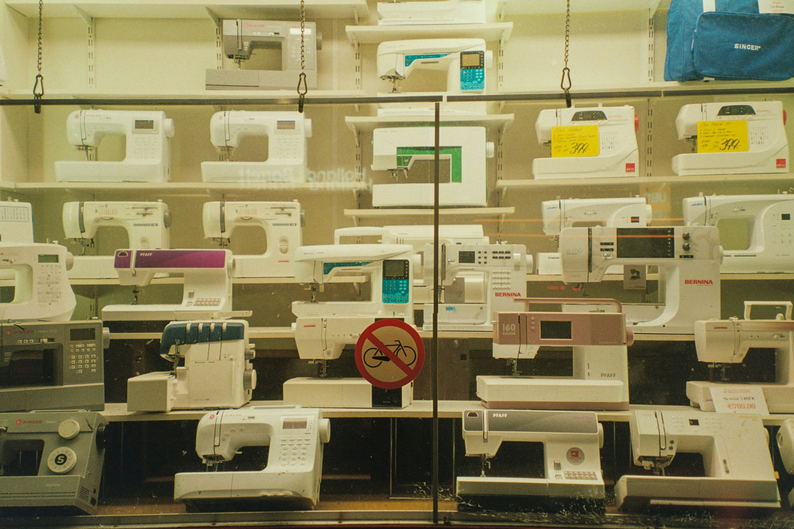 A room filled with lots of sewing machines