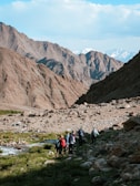 A group of people hiking up a mountain