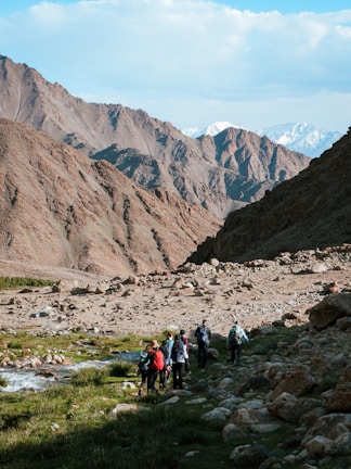 A group of people hiking up a mountain