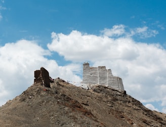 A large hill with a castle on top of it