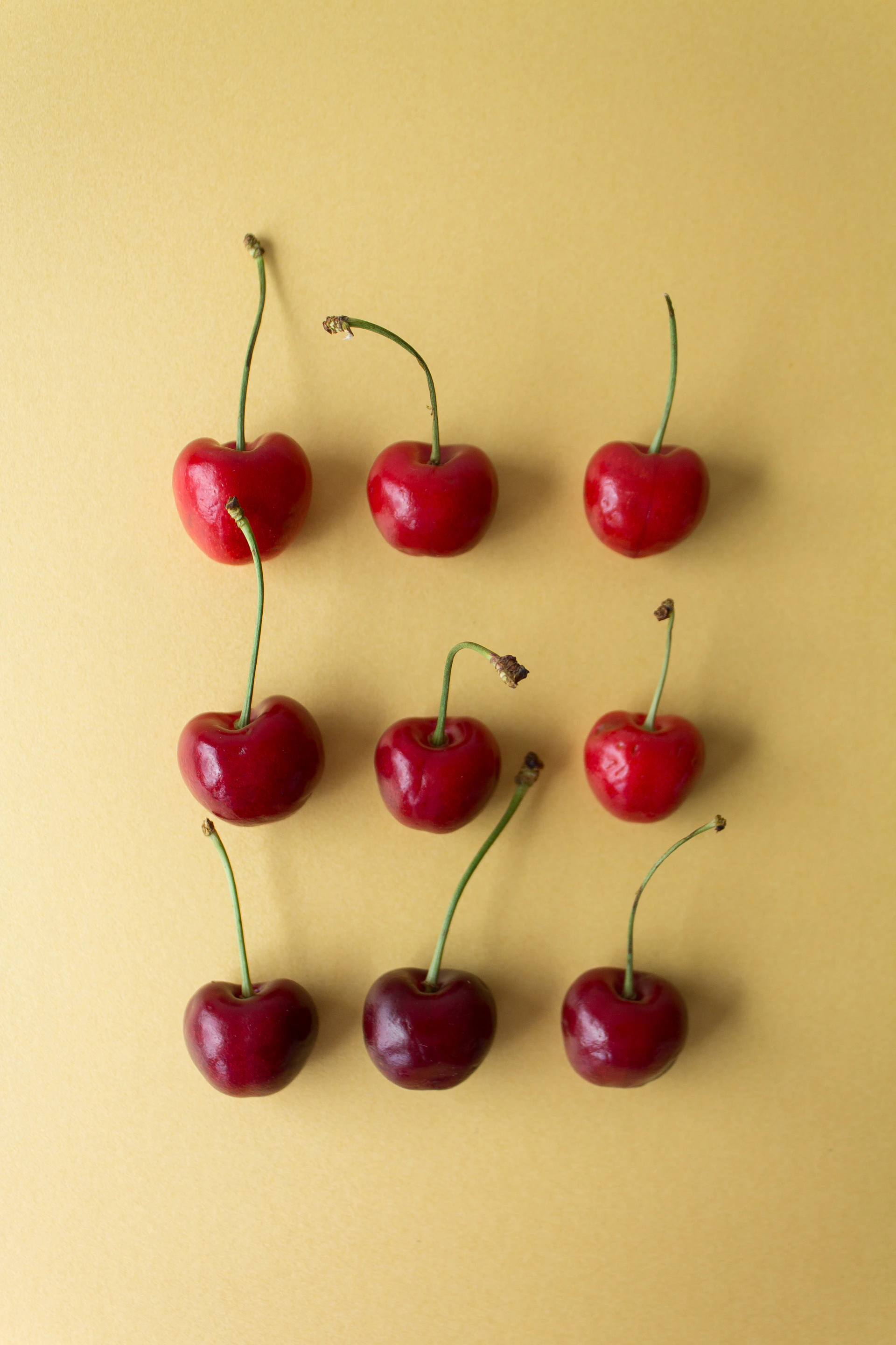 A group of cherries sitting on top of a table