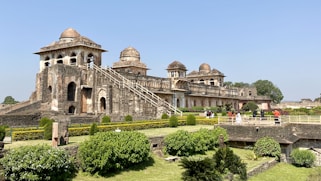 A large building with a lot of trees in front of it