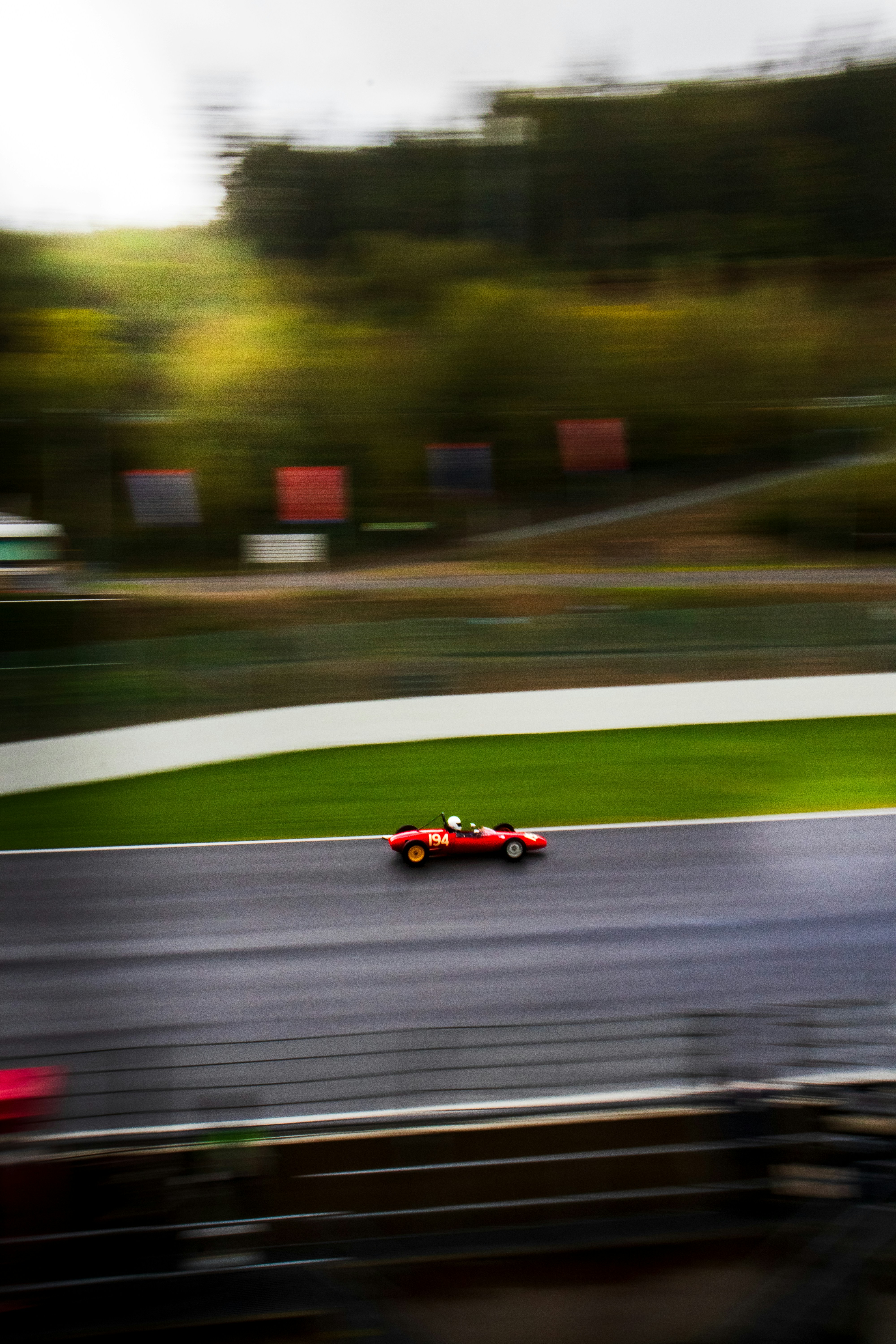 A blurry photo of a race car on a track
