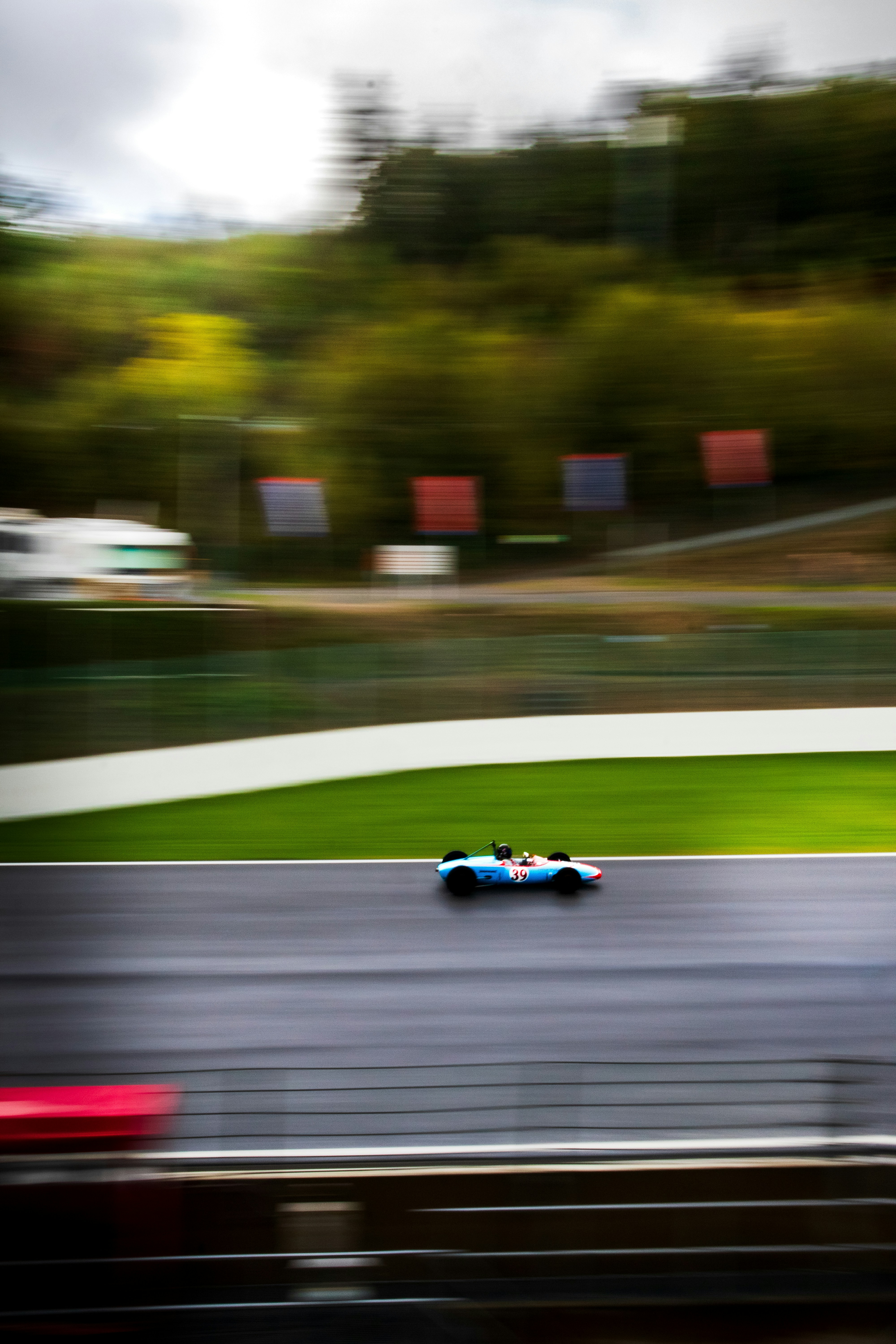A blurry photo of a racing car on a track