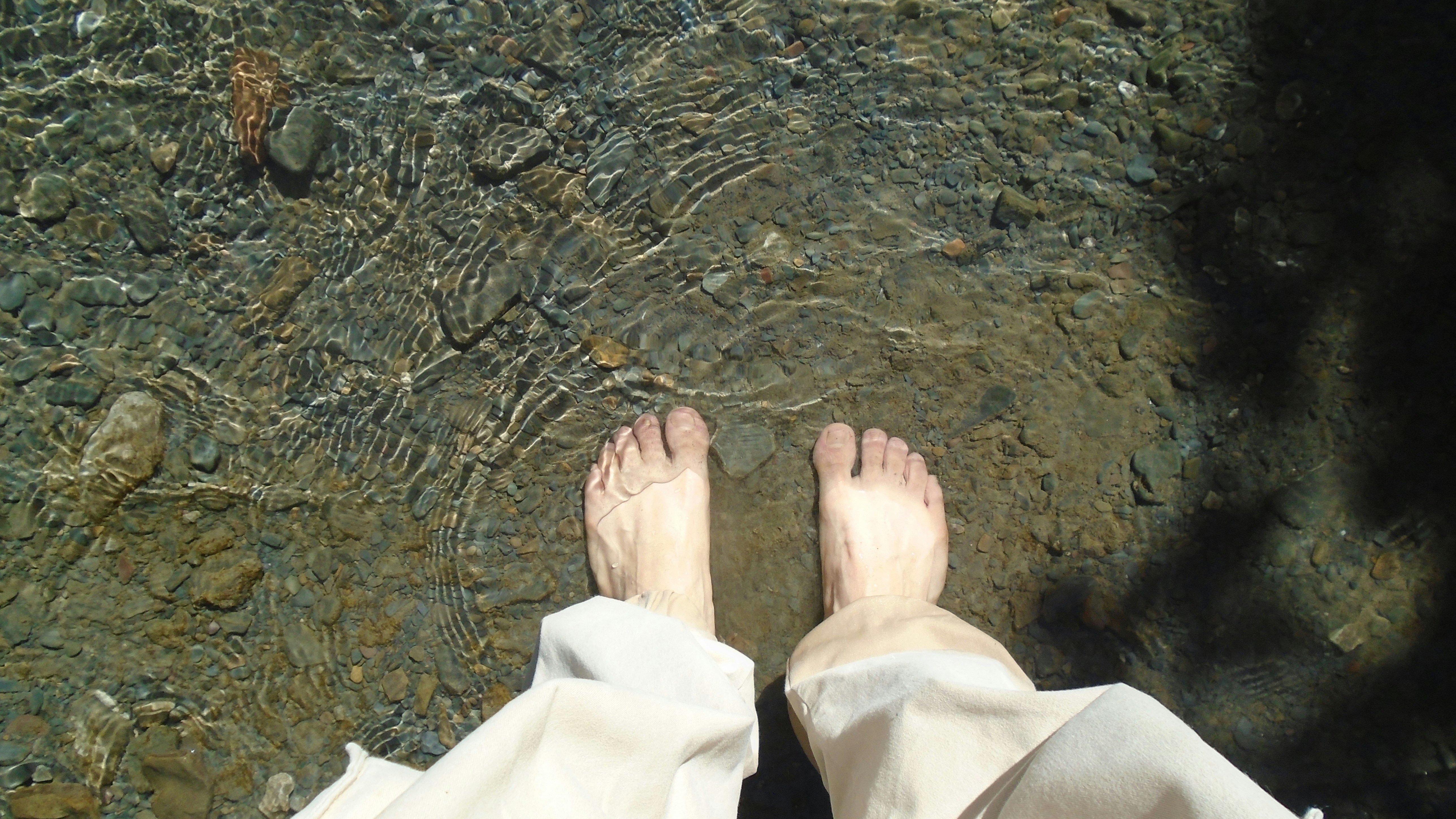 water pooling around feet in a shower drain - drain cleaning benefits and when to call a pro
