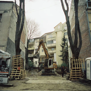 A construction site in a residential area with construction equipment